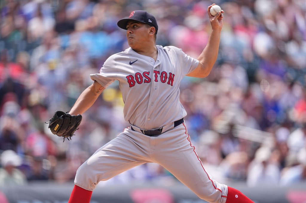 Boston Red Sox starting pitcher Ranger Suarez works against the Colorado Rockies in the sixth inning of a baseball game Wednesday, June 24, 2026, in Denver. (AP Photo/David Zalubowski)