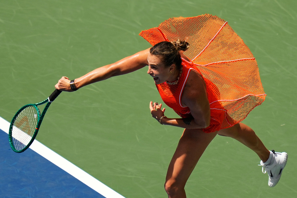 Aryna Sabalenka, of Belarus, follows through on a shot to Camila Osorio, of Colombia, during the first round of the U.S. Open tennis championships, Monday, Aug. 31, 2026, in New York. (AP Photo/Seth Wenig)