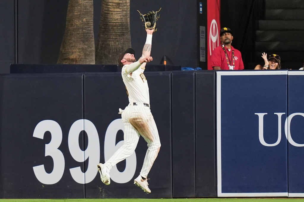 San Diego Padres center fielder Jackson Merrill makes the catch for the out on San Francisco Giants' Christian Koss during the eighth inning of a baseball game Thursday, July 30, 2026, in San Diego. (AP Photo/Gregory Bull)