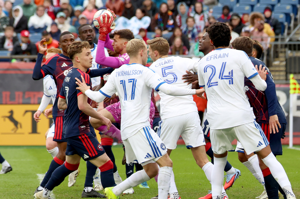New England Revolution goalkeeper Matt Turner, center, catches the ball on a penalty kick in the first half of an MLS soccer match against CF Montreal, Saturday, April 4, 2026, in Foxborough, Mass. (AP Photo/Mark Stockwell)