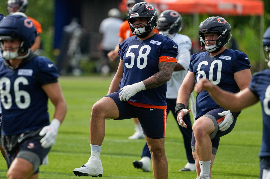 Chicago Bears offensive line Darnell Wright warms up during practice at the team's NFL football training camp, Friday, July 31, 2026, in Lake Forest, Ill. (AP Photo/Nam Y. Huh)