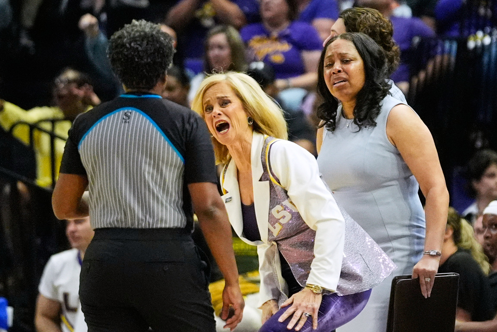 LSU head coach Kim Mulkey challenges an official during the first half in the second round of the NCAA college basketball tournament against Texas Tech, Sunday, March 22, 2026, in Baton Rouge, La. (AP Photo/Gerald Herbert)