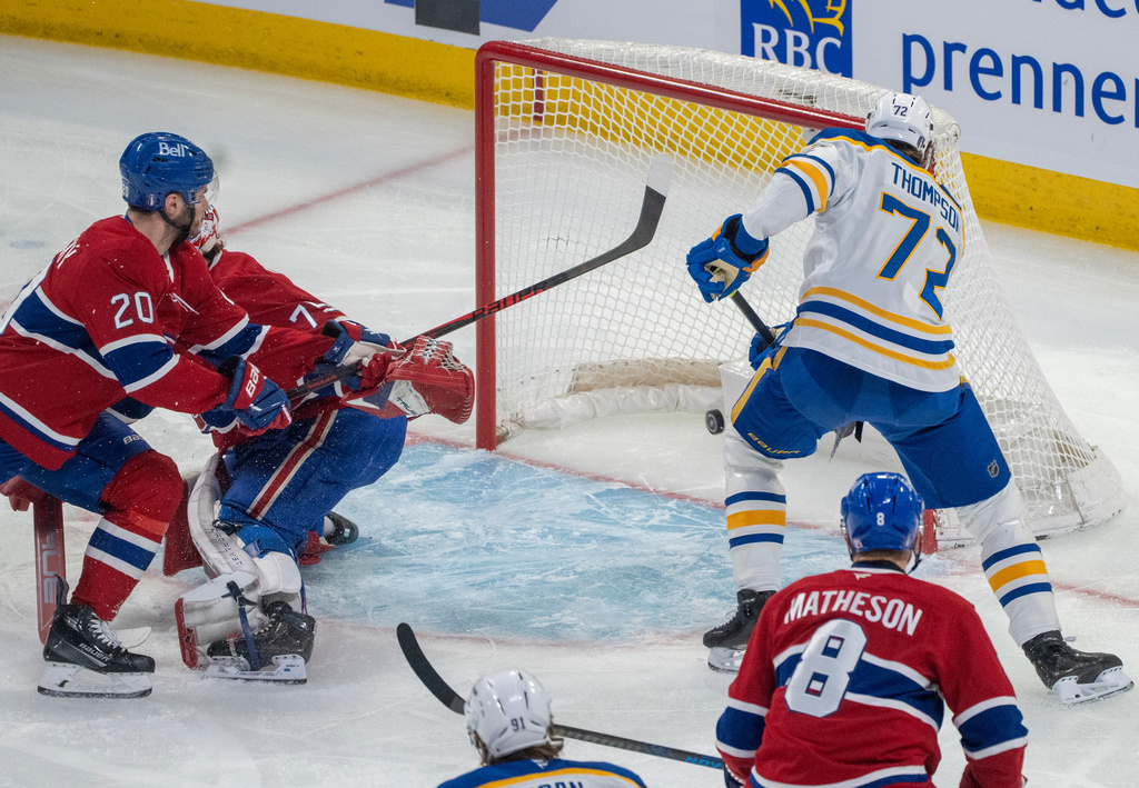 Buffalo Sabres' Tage Thompson (72) scores on Montreal Canadiens goaltender Jakub Dobes (75) as Canadiens' Juraj Slafkovsky (20) defends during the first period of Game 3 in a second-round NHL hockey Stanley Cup playoff series in Montreal, Sunday, May 10, 2026. (Christinne Muschi/The Canadian Press via AP)