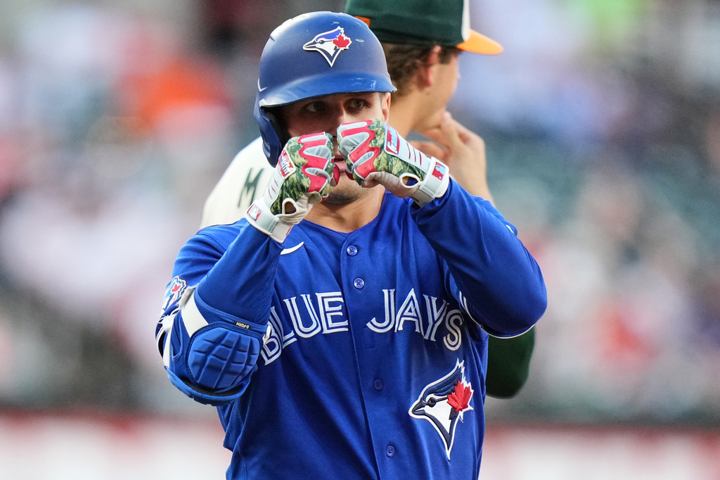 Toronto Blue Jays' Daulton Varsho celebrates after hitting a triple during the second inning of a baseball game against the Baltimore Orioles, Friday, May 29, 2026, in Baltimore. (AP Photo/Stephanie Scarbrough)