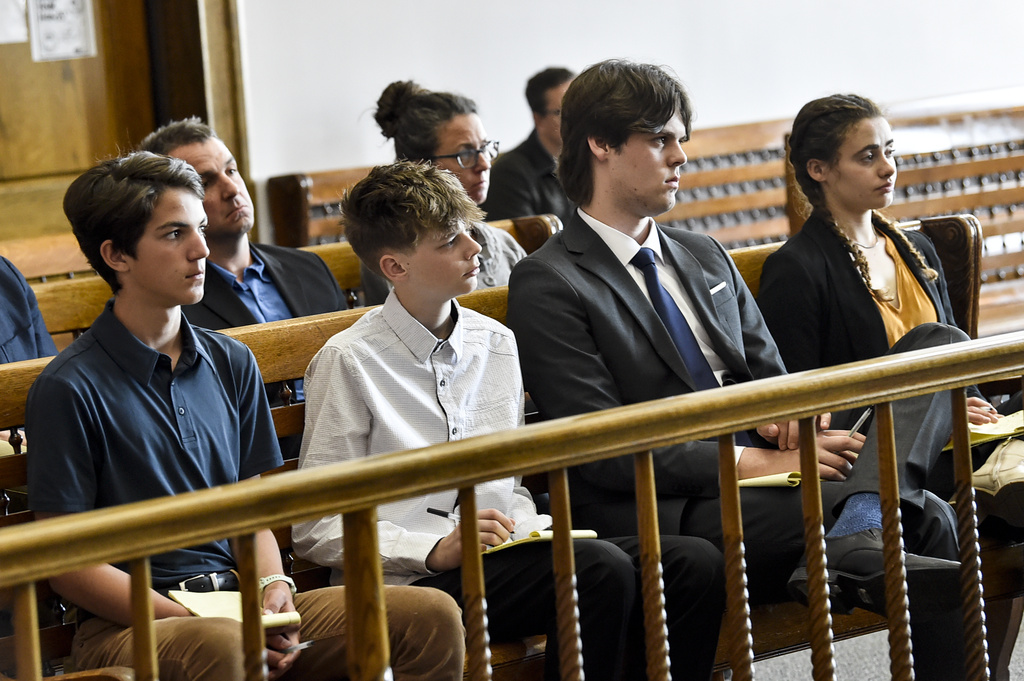 FILE - Plaintiffs in a climate lawsuit brought by children and young adults in Montana listen to arguments during a May 12, 2023, court hearing in Helena, Mont. (Thom Bridge/Independent Record via AP, file)/