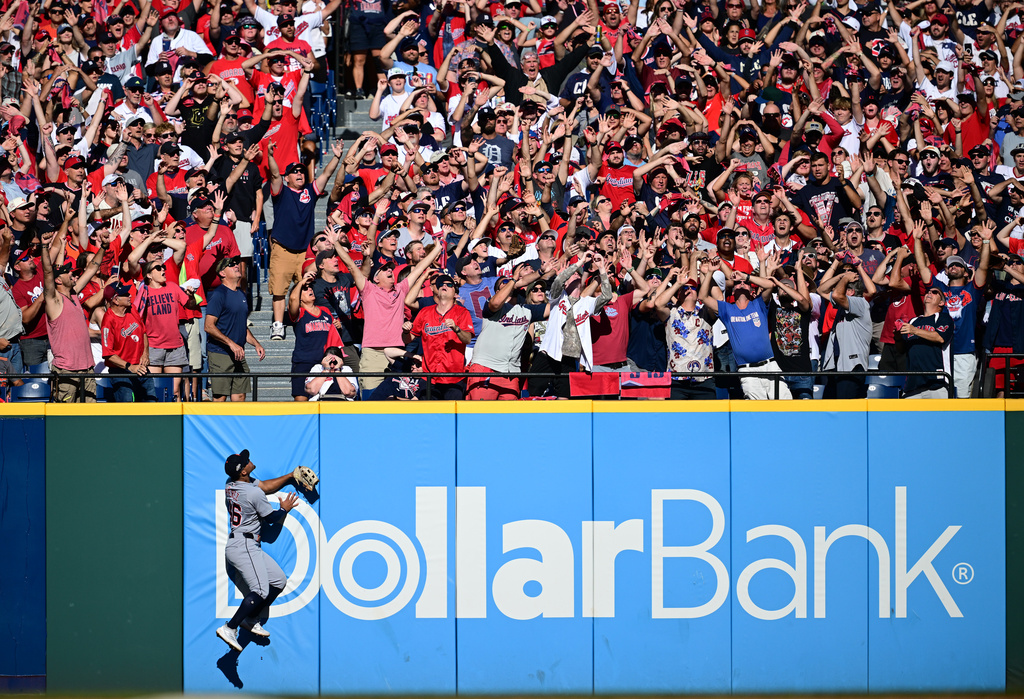 Detroit Tigers right fielder Wenceel Pérez watches as a three-run homer hit by Cleveland Guardians' Bo Naylor flies over the wall in the eighth inning of Game 2 of the American League Wild Card baseball playoff series in Cleveland, Wednesday, Oct. 1, 2025. (AP Photo/David Dermer)