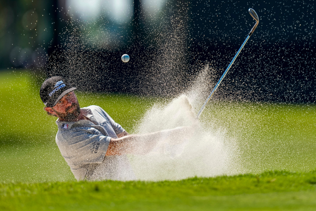 Cameron Young hits from the bunker on the eighth green during the second round of the Cadillac Championship PGA golf tournament Friday, May 1, 2026, in Doral, Fla. (AP Photo/David J. Phillip)