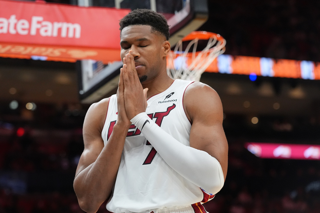 Miami Heat forward Giannis Antetokounmpo (7) has a moment of silence before the first half of an NBA preseason basketball game against the New Orleans PelicansThursday, Oct. 8, 2026, in Miami. (AP Photo/Marta Lavandier)