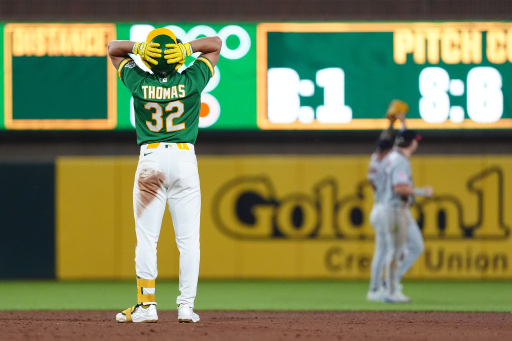 Athletics' Colby Thomas (32) reacts after hitting a long fly ball to the wall for an out in the eighth inning of a a baseball game against the Cleveland Guardians Friday, May 1, 2026, in West Sacramento, Calif. (AP Photo/Alan Greth)