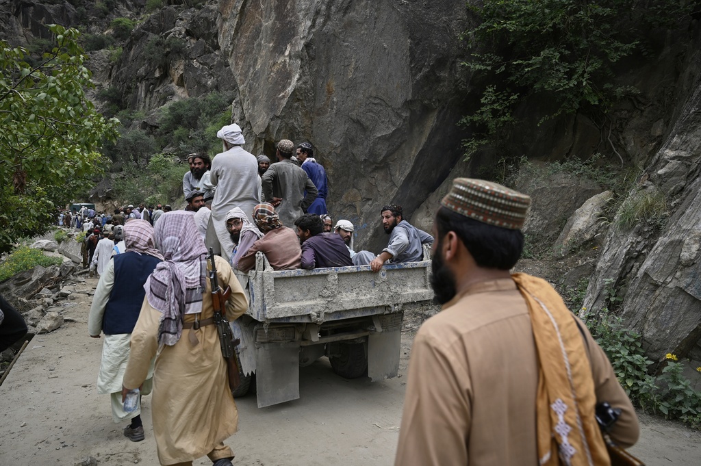 Residents from surrounding towns and villages try to reach the quake-hit region to assist survivors after Sunday night's powerful 6.0-magnitude earthquake that struck several provinces, in the Nurgol district, Kunar province, eastern Afghanistan, Tuesday, Sept. 2, 2025. (AP Photo/Nava Jamshidi)