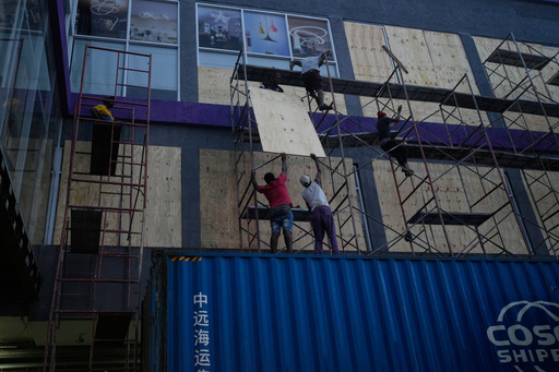 Workers board up shop windows ahead of Hurricane Melissa's forecast arrival in Kingston, Jamaica, Sunday, Oct. 26, 2025. (AP Photo/Matias Delacroix) Workers board up shop windows ahead of Hurricane Melissa's forecast arrival in Kingston, Jamaica, Sunday, Oct. 26, 2025. (AP Photo/Matias Delacroix)