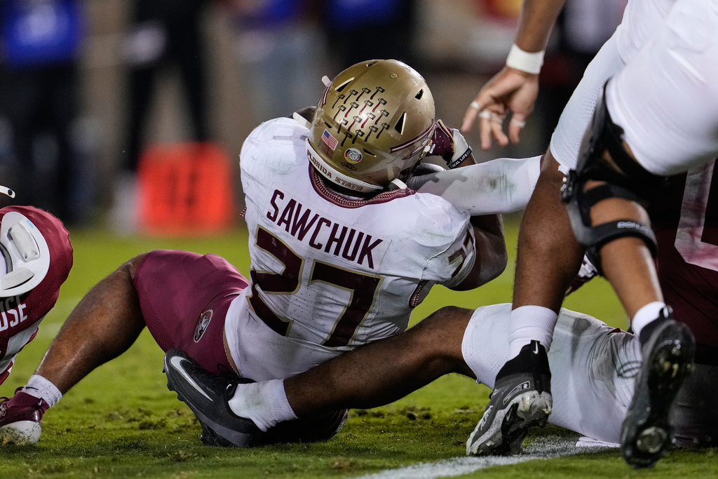 Florida State running back Gavin Sawchuk (27) is stopped short of the end zone by Stanford linebacker Jahsiah Galvan (0) to end an NCAA college football game, Saturday, Oct. 18, 2025, in Stanford, Calif. (AP Photo/Godofredo A. Vásquez)