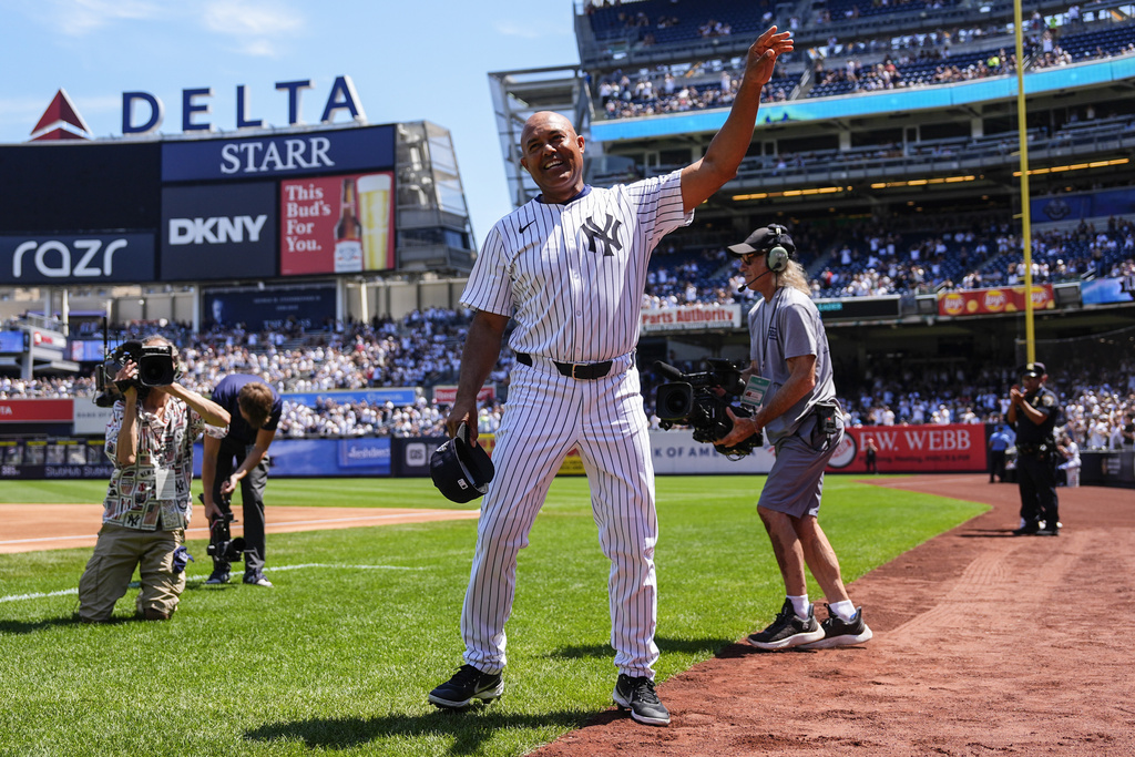 Former New York Yankees' Mariano Rivera (42) enters the Yankees Old-Timers' Day ceremony before a baseball game against the Houston Astros, Saturday, Aug. 9, 2025, in New York. (AP Photo/Yuki Iwamura)
