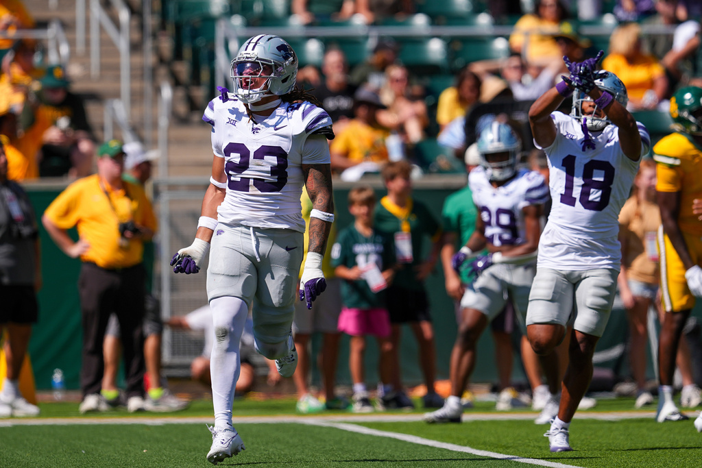 Kansas State linebacker Asa Newsom (23) and safety Wesley Fair (18) celebrate recovering the ball during the first half of an NCAA college football game against Baylor, Saturday, Oct. 4, 2025, in Waco, Texas. (AP Photo/Ronaldo Bolaños)