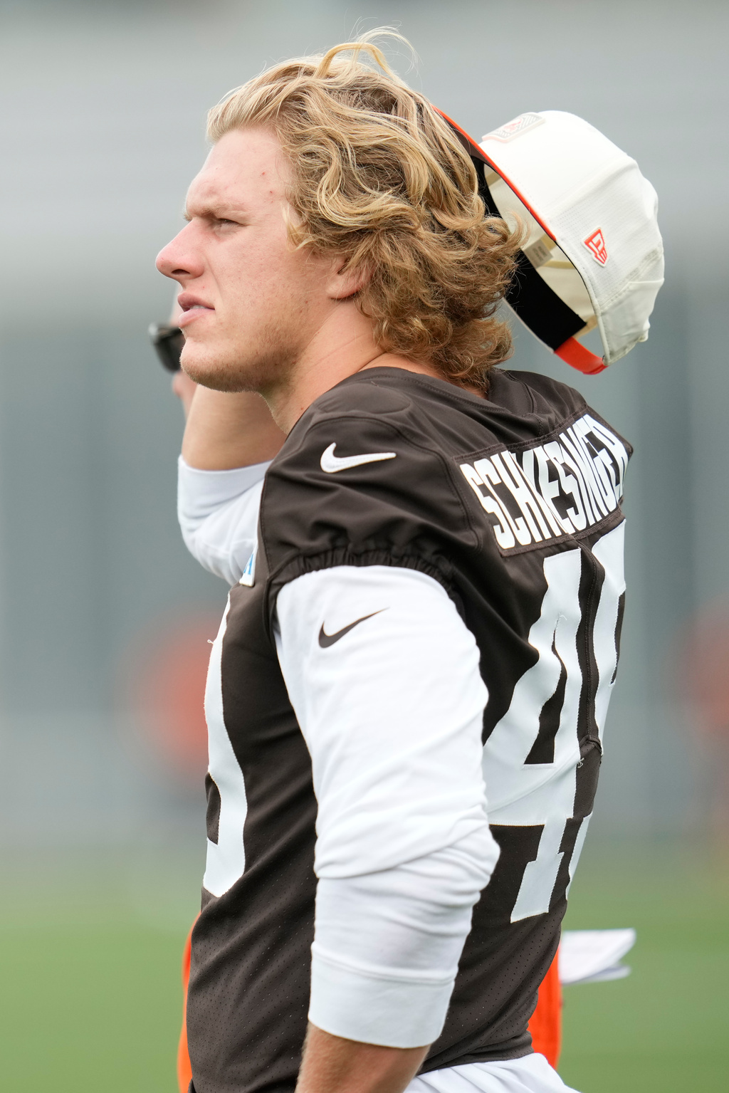 Cleveland Browns linebacker Carson Schwesinger (49) watches from the sidelines during an NFL football training camp, Saturday, Aug. 1, 2026, in Berea, Ohio. (AP Photo/Sue Ogrocki)