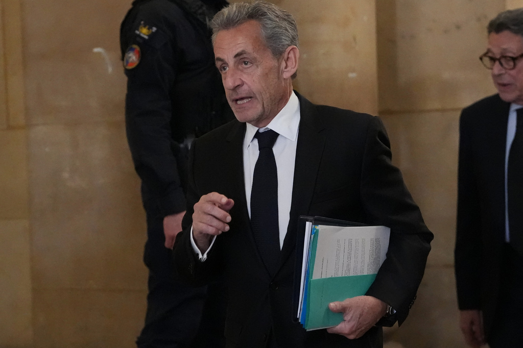 FILE- Former French President Nicolas Sarkozy arrives at the appeals courthouse in Paris, France, Monday, March 16, 2026, for his trial over alleged illegal financing of his 2007 presidential campaign by the government of late Libyan leader Moammar Gadhafi. (AP Photo/Thibault Camus, File)