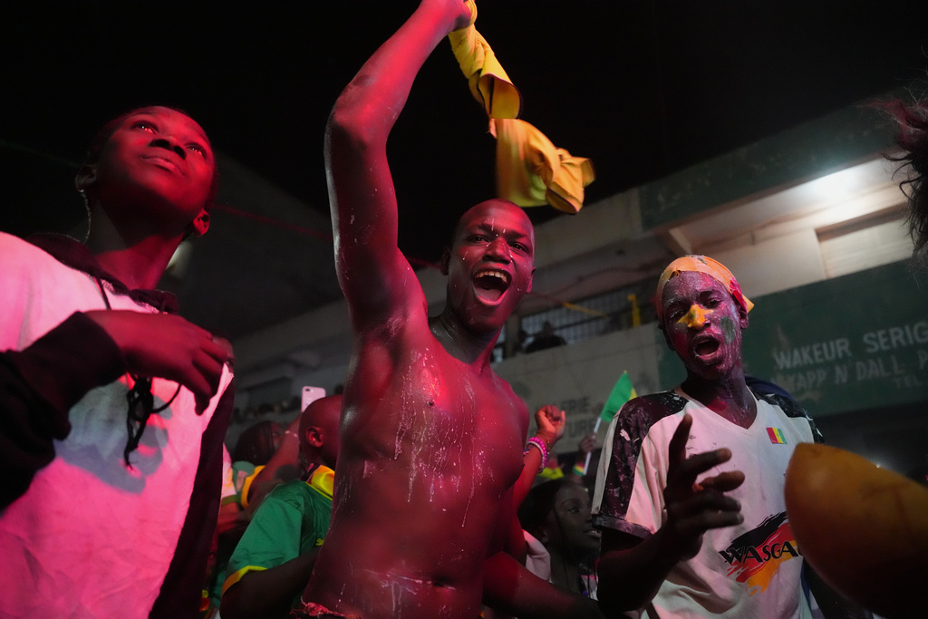 Fans celebrate Senegal's victory of the Africa Cup of Nations final soccer match between Senegal and Morocco in Dakar, Senegal, Sunday, Jan. 18, 2026. (AP Photo/Misper Apawu)