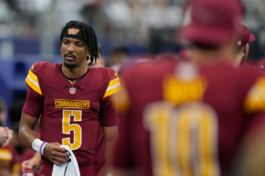 Washington Commanders quarterback Jayden Daniels walks on the sideline during the first half of an NFL football game against the Dallas Cowboys Sunday, Oct. 19, 2025, in Arlington, Texas. (AP Photo/Tony Gutierrez)