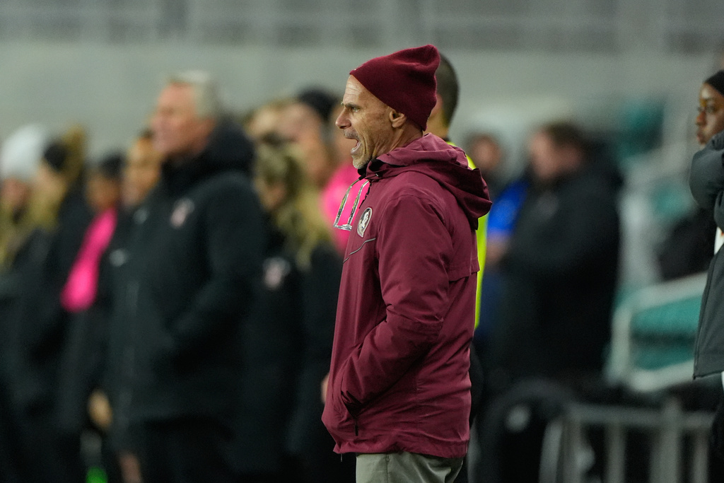 Florida State head coach Brian Penske is seen during the first half of the NCAA college soccer tournament final against Stanford Monday, Dec. 8, 2025, in Kansas City, Mo. (AP Photo/Charlie Riedel)