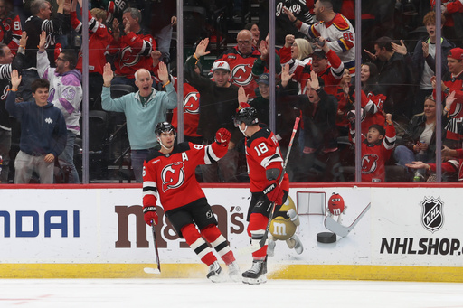 New Jersey Devils' Jack Hughes, left, and Ondrej Palat, right, react after Hughes scored during the first period of an NHL hockey game against the Colorado Avalanche Sunday, Oct. 26, 2025, in Newark, N.J. (AP Photo/Pamela Smith) New Jersey Devils' Jack Hughes, left, and Ondrej Palat, right, react after Hughes scored during the first period of an NHL hockey game against the Colorado Avalanche Sunday, Oct. 26, 2025, in Newark, N.J. (AP Photo/Pamela Smith)