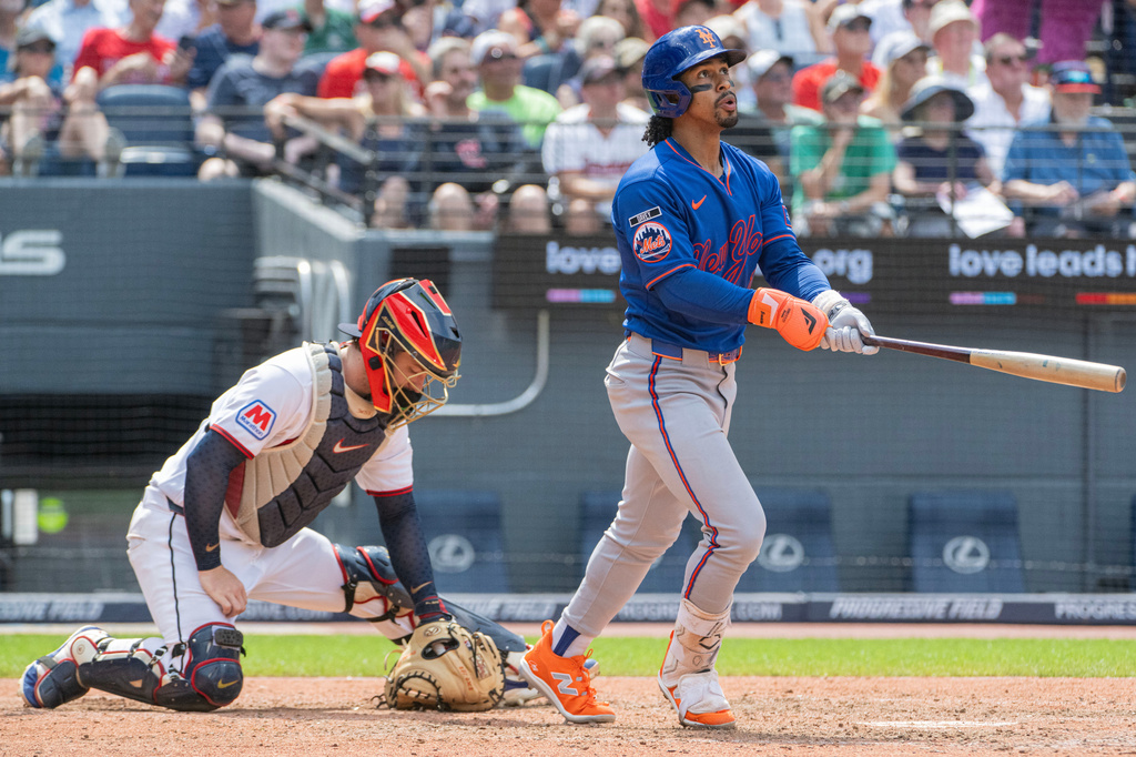 New York Mets' Francisco Lindor watches his three-run home run off Cleveland Guardians relief pitcher Craig Yoho as catcher Patrick Bailey looks down during the seventh inning of a baseball game, Thursday, Aug. 6, 2026, in Cleveland. (AP Photo/Phil Long)