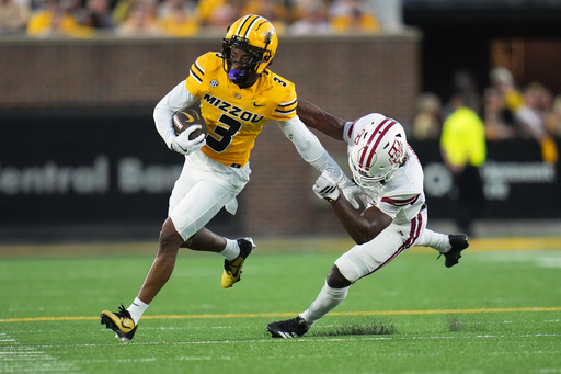 Missouri wide receiver Kevin Coleman Jr., left, runs with the ball as Massachusetts defensive lineman Zachary Farris defends during the first half of an NCAA college football game Saturday, Sept. 27, 2025, in Columbia, Mo. (AP Photo/Jeff Roberson) Missouri wide receiver Kevin Coleman Jr., left, runs with the ball as Massachusetts defensive lineman Zachary Farris defends during the first half of an NCAA college football game Saturday, Sept. 27, 2025, in Columbia, Mo. (AP Photo/Jeff Roberson)