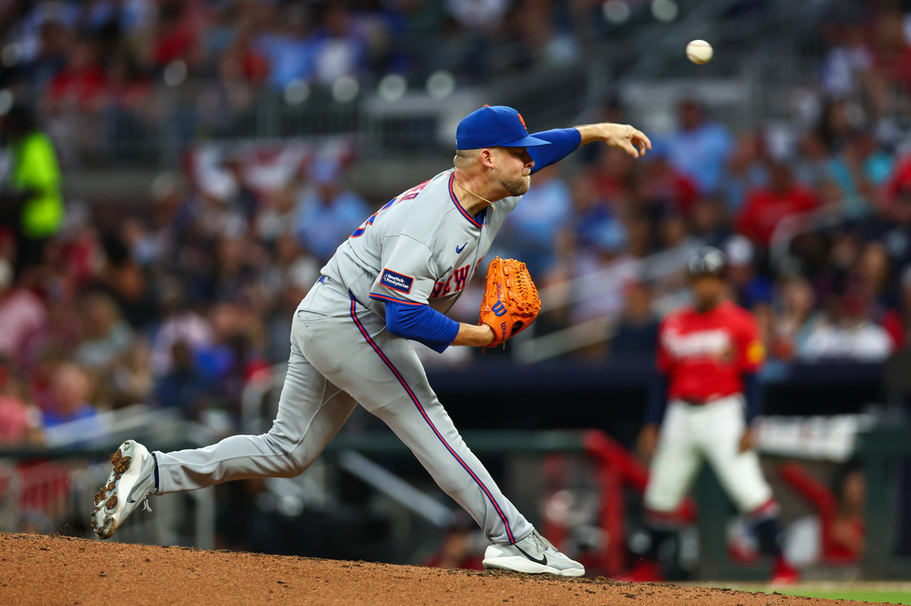 New York Mets pitcher A.J. Minter delivers in the fifth inning of a baseball game against the Atlanta Braves, Friday, July 3, 2026, in Atlanta. (AP Photo/Colin Hubbard)