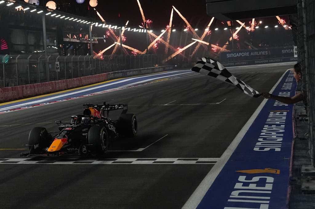 Red Bull driver Max Verstappen of the Netherlands crosses the finish line to win the Singapore Formula One Grand Prix race in Singapore, Sunday, Oct. 11, 2026. (AP Photo/Ng Han Guan, Pool)