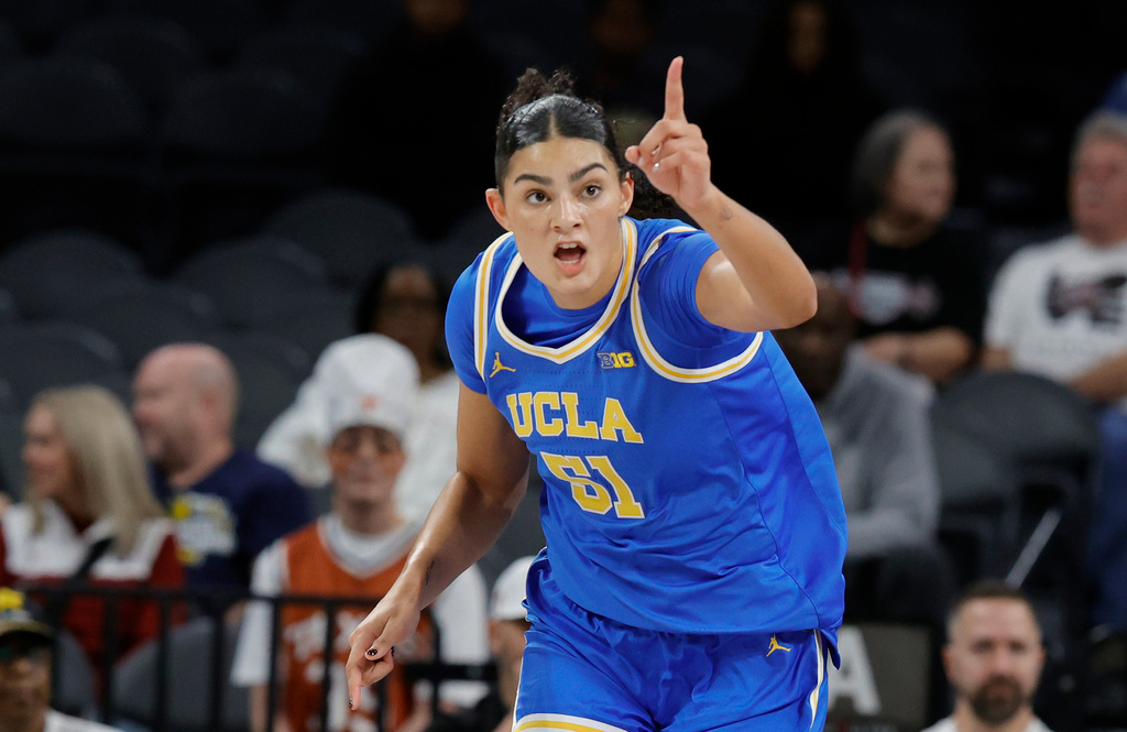 UCLA center Lauren Betts (51) reacts after making a basket against Texas during the first half of an NCAA college basketball game in the Players Era tournament Wednesday, Nov. 26, 2025, in Las Vegas. (AP Photo/Steve Marcus)