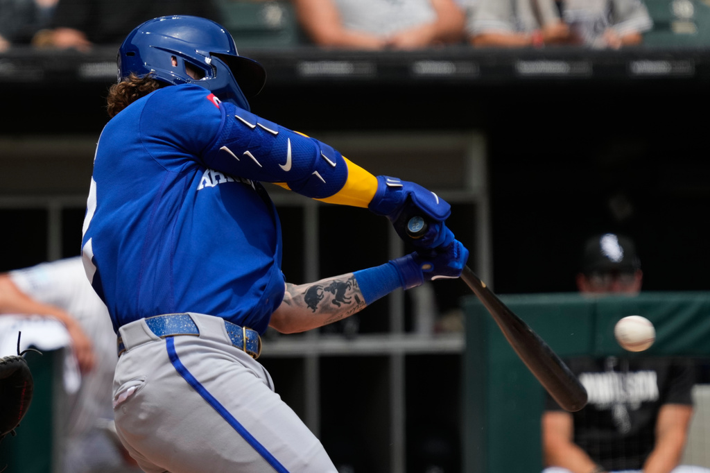 Kansas City Royals' Carter Jensen hits a one-run single during the first inning of a baseball game against the Chicago White Sox in Chicago, Sunday, June 28, 2026. (AP Photo/Nam Y. Huh)