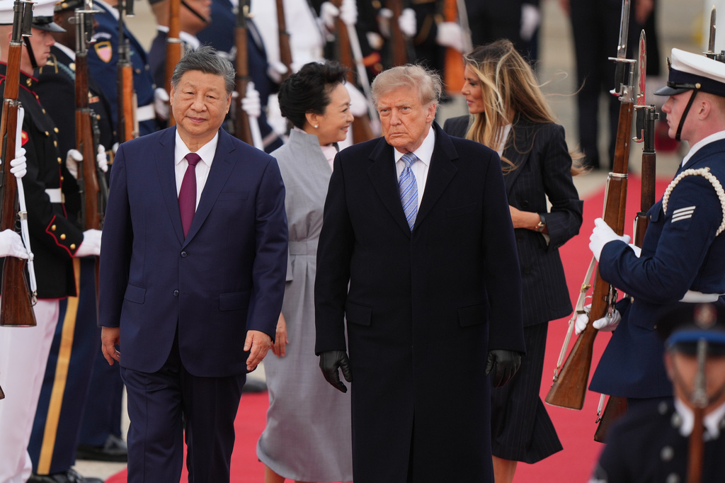 President Donald Trump and first lady Melania Trump greet Chinese President Xi Jinping and his wife Peng Liyuan as they arrive at Joint Base Andrews, Md., Wednesday, Sept. 23, 2026. (AP Photo/Mark Schiefelbein)