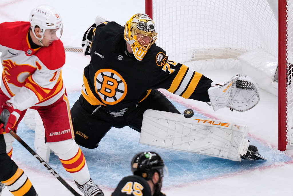 Boston Bruins goaltender Joonas Korpisalo (70) reaches for a save during the second period of an NHL hockey game against the Calgary Flames, Thursday, Jan. 8, 2026, in Boston. (AP Photo/Charles Krupa)