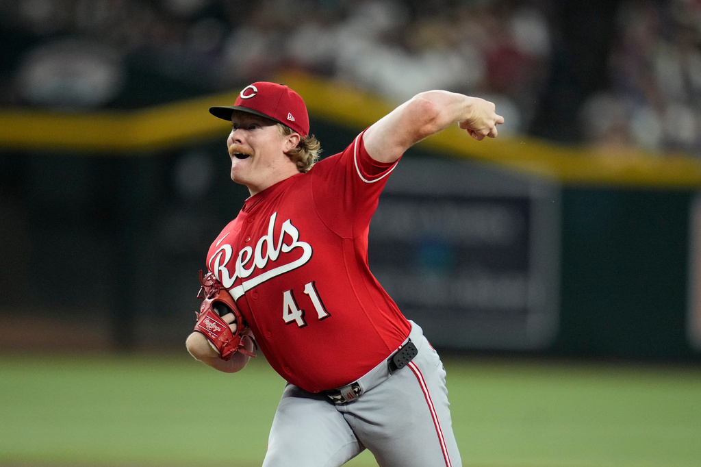 Cincinnati Reds starting pitcher Andrew Abbott throws against the Arizona Diamondbacks during the first inning of a baseball game, Sunday, Aug. 23, 2026, in Phoenix. (AP Photo/Ross D. Franklin)
