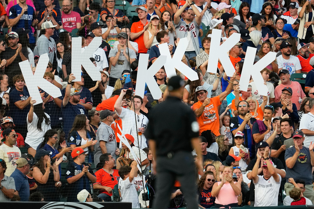 Fans hold up K signs for Detroit Tigers pitcher Tarik Skubal strikeouts against the Kansas City Royals during the eighth inning of a baseball game Friday, July 24, 2026, in Detroit. (AP Photo/Paul Sancya)
