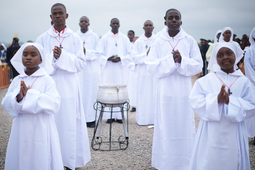 Faithful wait for Pope Leo XIV at Yaounde Ville Airport, Cameroon, Saturday, April 18, 2026 on the sifth day of his 11-day pastoral visit to Africa. (AP Photo/Andrew Medichini)