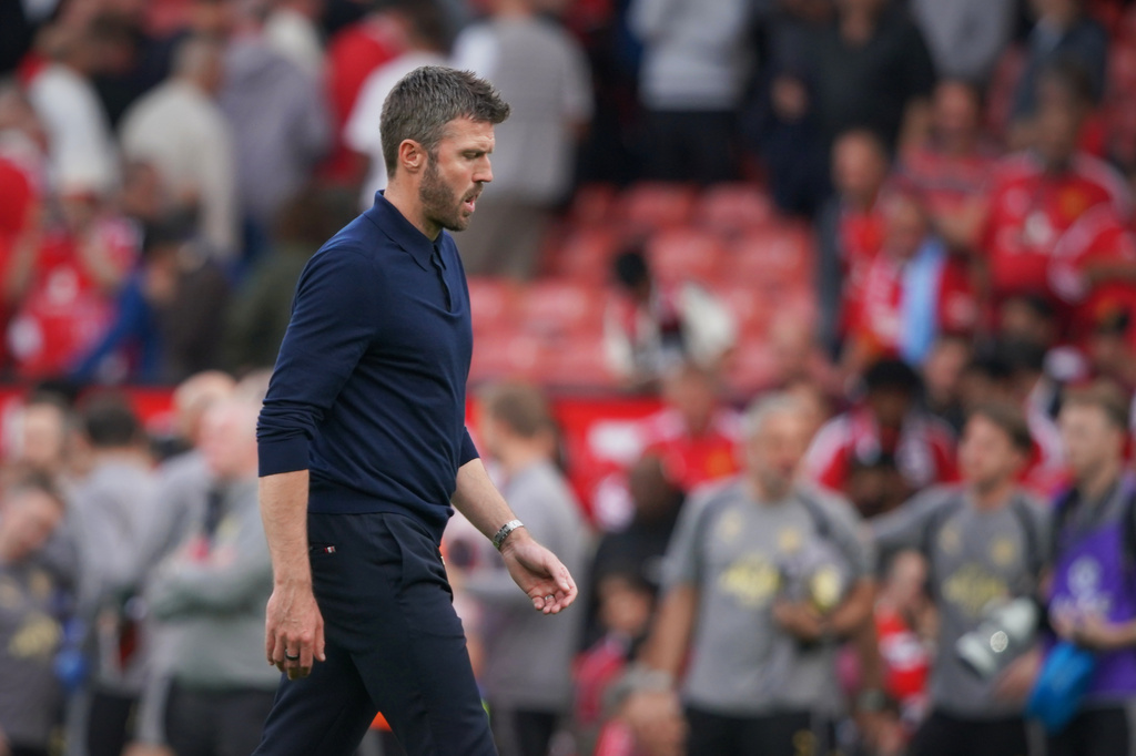 Manchester United's head coach Michael Carrick walks on the pitch at the end of the English Premier League soccer match between Manchester United and Manchester City in Manchester, England, Sunday, Sept. 13, 2026. (AP Photo/Ian Hodgson)
