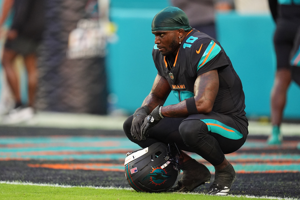 Miami Dolphins wide receiver Tyreek Hill sits in the end zone before an NFL football game against the New York Jets, Monday, Sept. 29, 2025, in Miami Gardens, Fla. (AP Photo/Rebecca Blackwell)