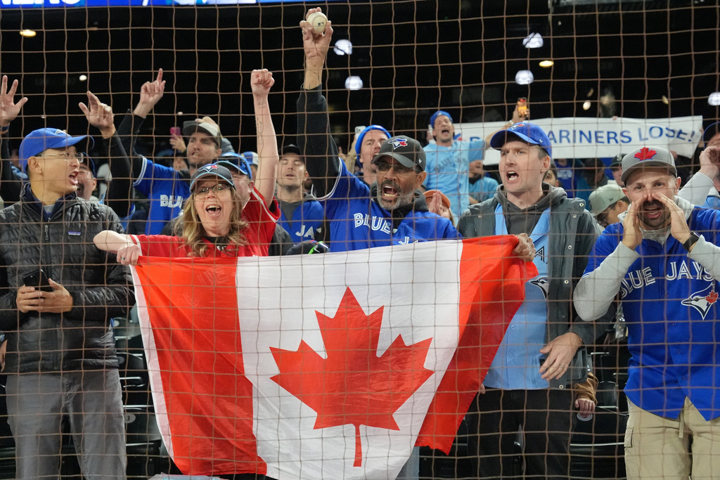 Toronto Blue Jays fans celebrate after the Toronto Blue Jays defeated the Seattle Mariners in Game 3 American League Championship Series baseball action in Seattle on Wednesday, Oct. 15, 2025. (Frank Gunn/The Canadian Press via AP)