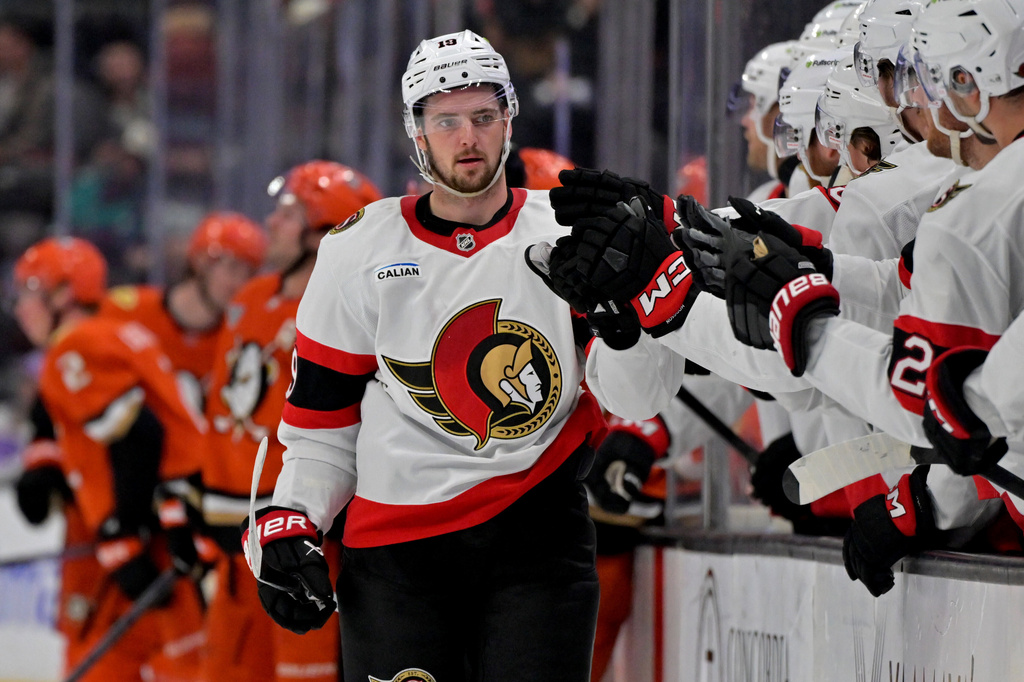 CORRECTS TO THIRD PERIOD - Ottawa Senators right wing Drake Batherson is congratulated after scoring the winning goal during the third period of an NHL hockey game against the Anaheim Ducks, Thursday, Nov. 20, 2025, in Anaheim, Calif. (AP Photo/Jayne Kamin-Oncea)