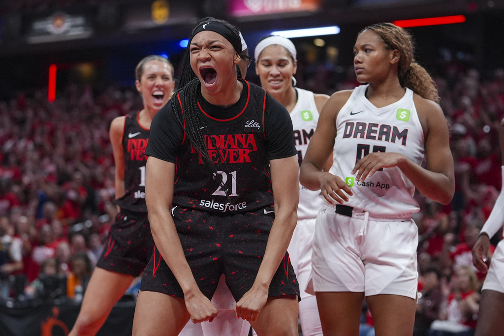 Indiana Fever forward Makayla Timpson (21) celebrates after hitting a basket and being fouled by the Atlanta Dream in the second half of a WNBA basketball playoff game in Indianapolis, Tuesday, Sept. 16, 2025. (AP Photo/Michael Conroy)