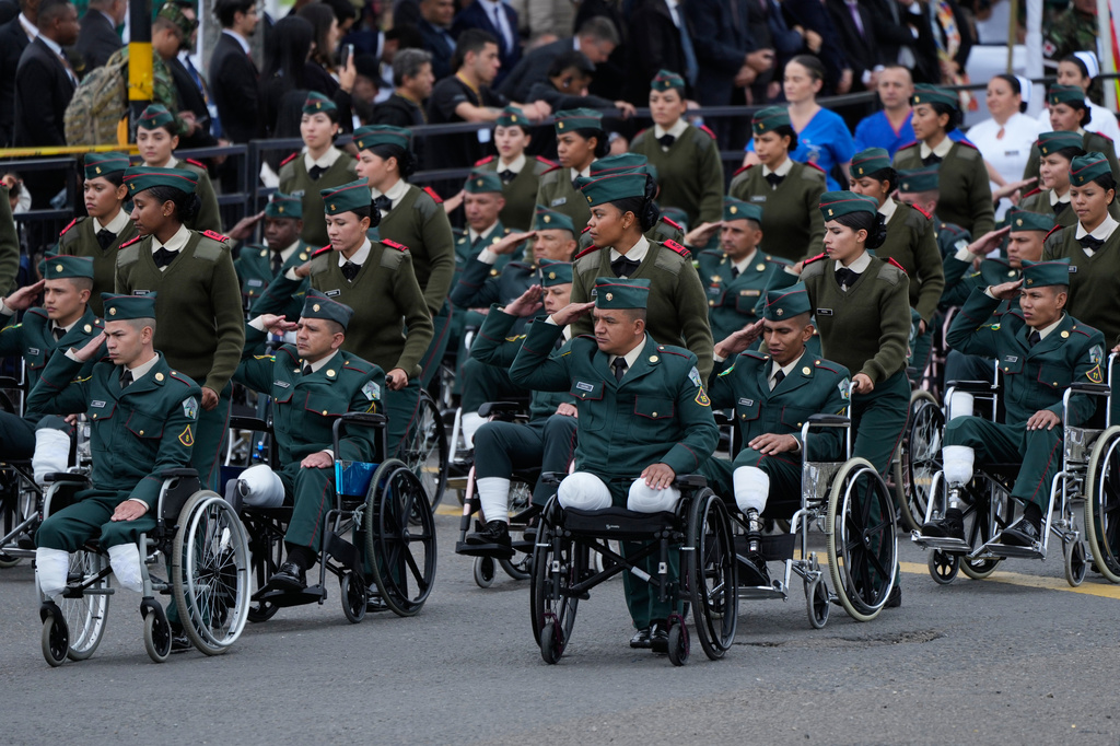Military personnel who lost their limbs in the line of duty attend the parade marking Colombia's Independence Day in Bogota, Colombia, Monday, July 20, 2026. (AP Photo/Fernando Vergara)