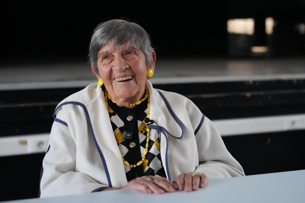 Ginette Kolinka, a 101-year-old survivor of Auschwitz, smiles after a meeting with pupils in a Paris-region high school in Saint-Maur-des-Fosses, outside Paris, France, March 21, 2026. (AP Photo/Thibault Camus)