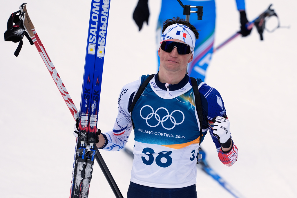 Eric Perrot, of France, reacts after finishing the men's 20-kilometer individual biathlon race at the 2026 Winter Olympics in Anterselva, Italy, Tuesday, Feb. 10, 2026. (AP Photo/Andrew Medichini)