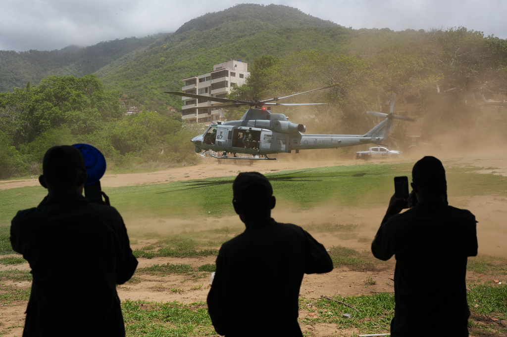 A U.S. military helicopter takes off after landing in La Guaira, Venezuela, three days after earthquakes struck, Saturday, June 27, 2026. (AP Photo/Matias Delacroix)
