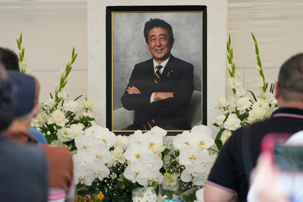 FILE - People offer prayers for former Prime Minister Shinzo Abe at Zojoji temple in Tokyo, Japan, July 8, 2023. (AP Photo/Shuji Kajiyama, File)