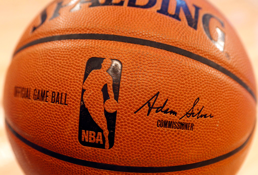FILE - An NBA logo is seen on an official game ball before a basketball game, Feb. 1, 2014, in New York. (AP Photo/Jason DeCrow, file) FILE - An NBA logo is seen on an official game ball before a basketball game, Feb. 1, 2014, in New York. (AP Photo/Jason DeCrow, file)