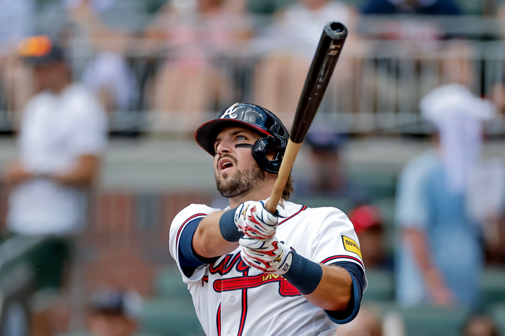 Atlanta Braves' Austin Riley follows through on a solo home run against the Texas Rangers during the second inning of a baseball game, Sunday, July 19, 2026, in Atlanta. (AP Photo/Erik S. Lesser)