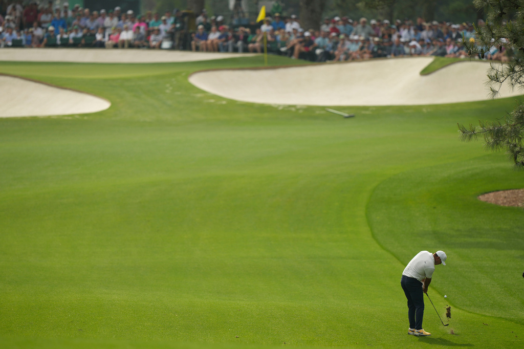 FILE - Brooks Koepka hits from the fairway on the seventh hole during the second round of the Masters golf tournament at Augusta National Golf Club on Friday, April 7, 2023, in Augusta, Ga. (AP Photo/Charlie Riedel, File)