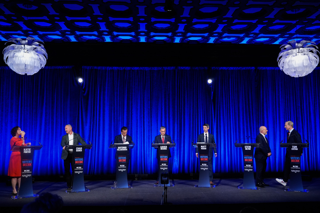From left, Katie Porter, Chad Bianco, Antonio Villaraigosa, Xavier Becerra, Matt Mahan, Steve Hilton and Tom Steyer wait during a break at a California gubernatorial debate hosted by CBS Bay Area and the San Francisco Examiner in San Francisco, Thursday, May 14, 2026. (AP Photo/Godofredo A. Vásquez, Pool)