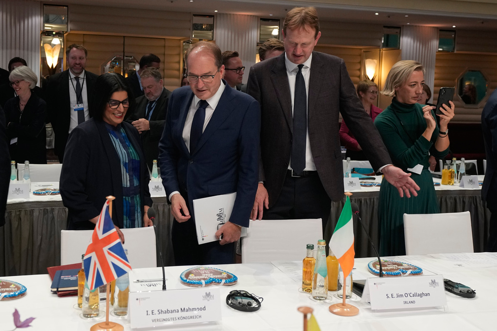 German Interior Minister Alexander Dobrindt, center, Minister for Justice Jim O'Callaghan, right, and Britain Home Secretary Shabana Mahmood arrive for the Munich Migration Meeting in Munich, Germany, Saturday, Sept. 26, 2026. (AP Photo/Matthias Schrader)